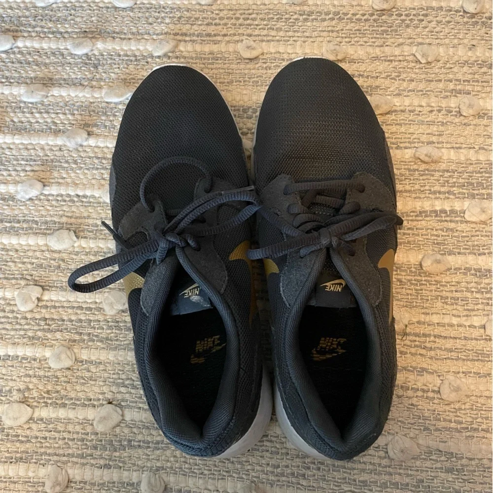 Nike Women’s 8.5 Black and Gold Sneakers